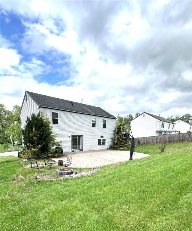 491 Peregrine Dr, North Huntingdon, PA 15642 - back of house featuring a patio and a fire pit