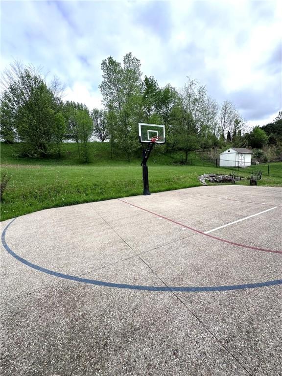 491 Peregrine Dr, North Huntingdon, PA 15642 - view of basketball court featuring a yard and basketball hoop