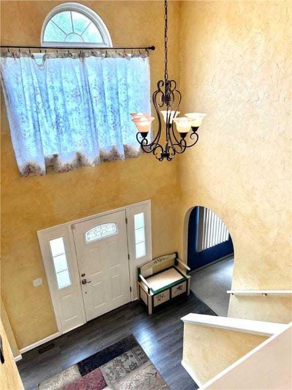 491 Peregrine Dr, North Huntingdon, PA 15642 - foyer with a chandelier, healthy amount of natural light, wood finished floors, and a high ceiling