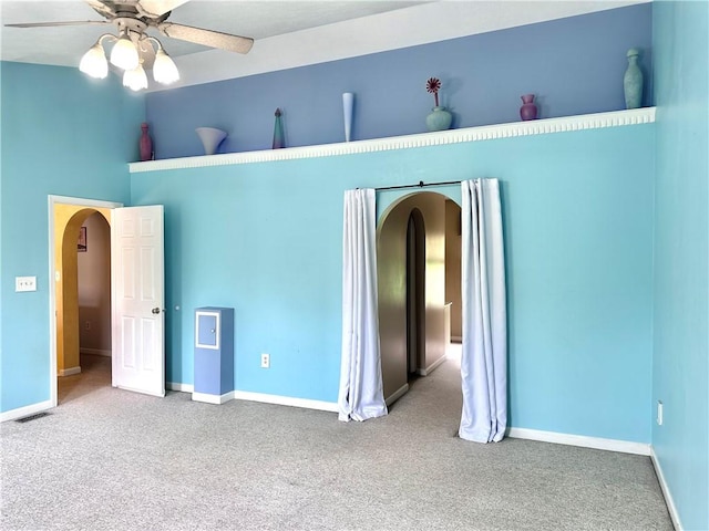 491 Peregrine Dr, North Huntingdon, PA 15642 - unfurnished bedroom featuring arched walkways, carpet flooring, and baseboards