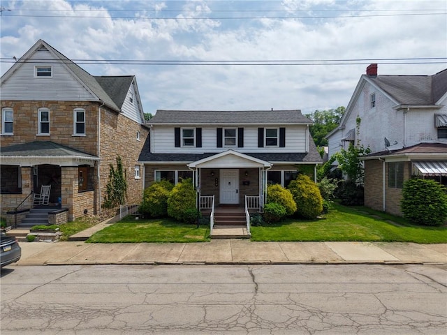 710 4th Ave, Ford City Boro, PA 16226 - traditional-style house featuring a front lawn and a porch