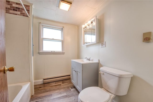 710 4th Ave, Ford City Boro, PA 16226 - full bathroom featuring a baseboard heating unit, toilet, wood finished floors, vanity, and a bathtub