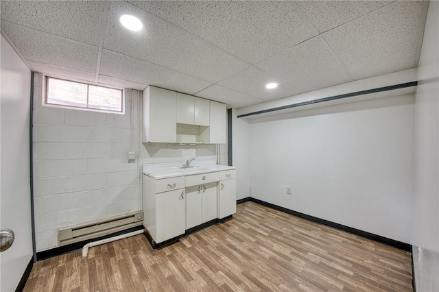 710 4th Ave, Ford City Boro, PA 16226 - laundry room featuring a baseboard heating unit, light wood finished floors, recessed lighting, baseboards, and a sink