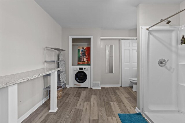 2611 Jane St, South Side, PA 15203 - washroom with washer / clothes dryer, wood finished floors, and baseboards