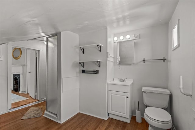 2611 Jane St, South Side, PA 15203 - bathroom featuring wood finished floors, toilet, vanity, and baseboards