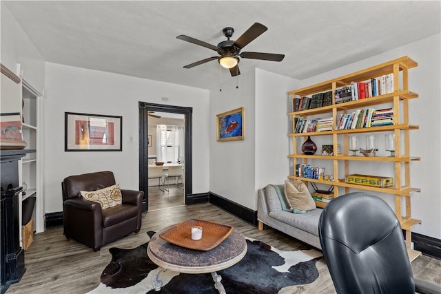 2611 Jane St, South Side, PA 15203 - living area with wood finished floors, ceiling fan, and baseboards
