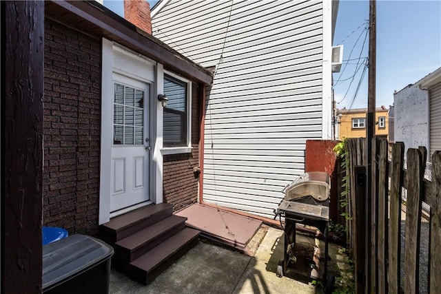 2611 Jane St, South Side, PA 15203 - entrance to property featuring brick siding, fence, and a chimney