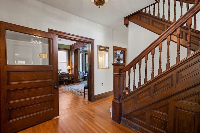 209 Bon Air Ave, Bon Air, PA 15210 - entrance foyer featuring stairway, light wood finished floors, baseboards, and a chandelier