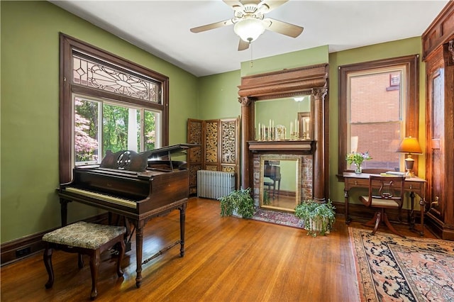 209 Bon Air Ave, Bon Air, PA 15210 - sitting room with radiator heating unit, wood finished floors, and ceiling fan