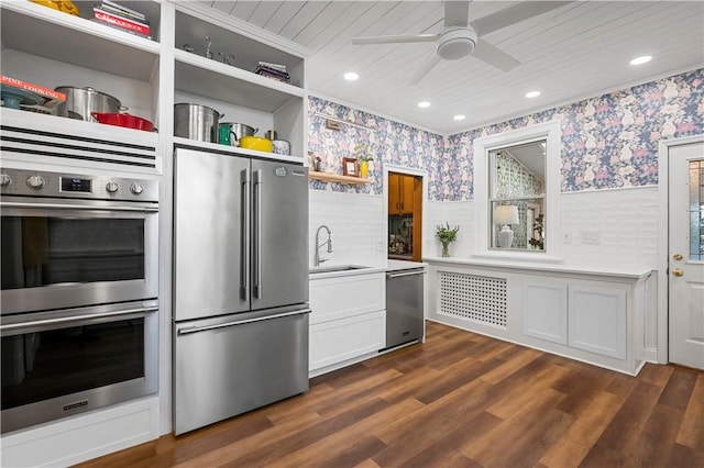 209 Bon Air Ave, Bon Air, PA 15210 - kitchen with stainless steel appliances, wallpapered walls, a sink, a wainscoted wall, and ceiling fan