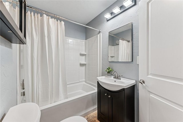 bathroom featuring toilet, a textured wall, shower / bathtub combination with curtain, and vanity