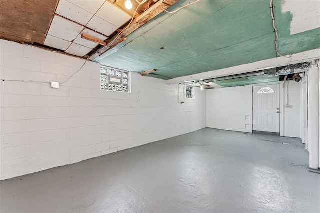 below grade area featuring concrete block wall