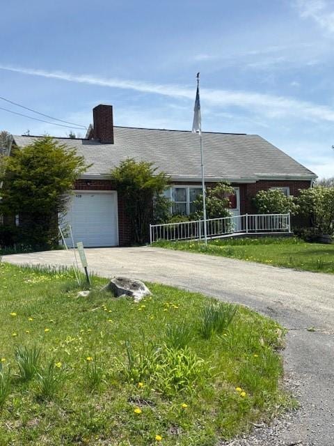 438 Fayette Springs Rd, Wharton Twp, PA 15421 - single story home with an attached garage, concrete driveway, and a chimney