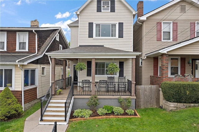 view of front of property featuring a porch and a front yard