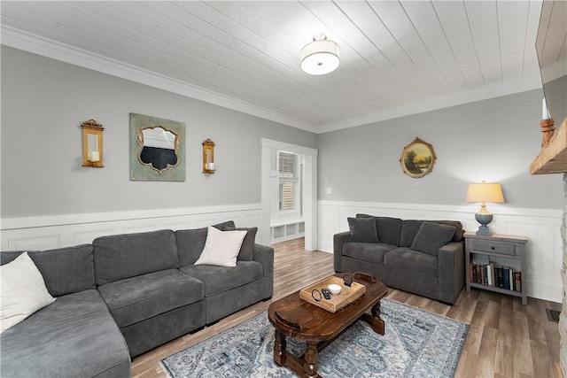 living room with crown molding, wainscoting, wood ceiling, and wood finished floors
