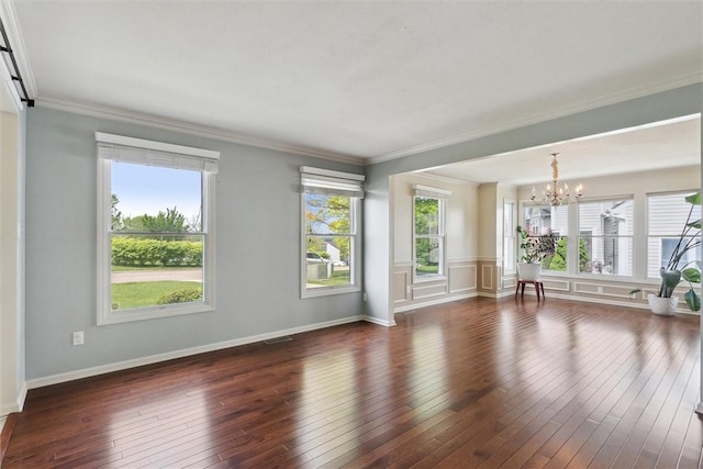 921 Bideford Dr, South Park, PA 15129 - empty room featuring a chandelier, dark wood-type flooring, crown molding, and baseboards