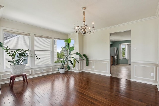 921 Bideford Dr, South Park, PA 15129 - unfurnished dining area featuring a decorative wall, hardwood / wood-style floors, a chandelier, ornamental molding, and wainscoting
