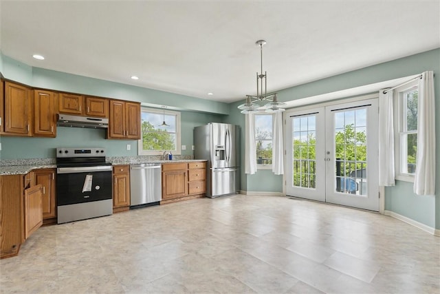 921 Bideford Dr, South Park, PA 15129 - kitchen with stainless steel appliances, under cabinet range hood, brown cabinets, french doors, and recessed lighting