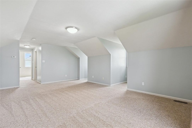 921 Bideford Dr, South Park, PA 15129 - additional living space with light colored carpet, lofted ceiling, and baseboards