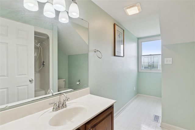 921 Bideford Dr, South Park, PA 15129 - bathroom featuring toilet, baseboards, vanity, and lofted ceiling