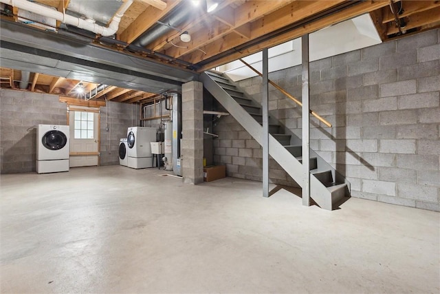 921 Bideford Dr, South Park, PA 15129 - basement featuring washing machine and dryer, stairs, gas water heater, concrete block wall, and heating unit