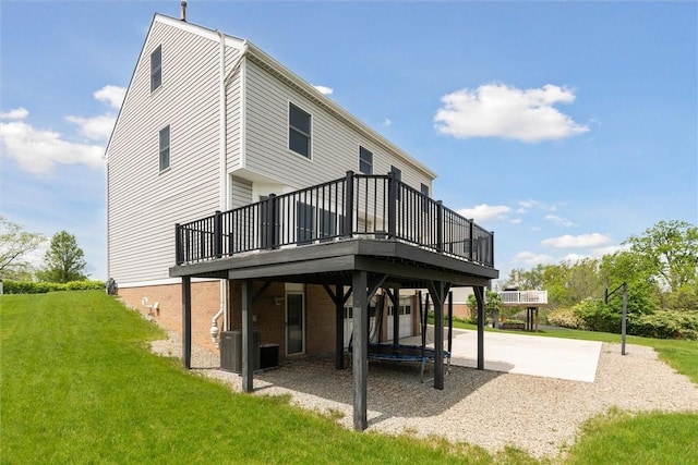 921 Bideford Dr, South Park, PA 15129 - rear view of house featuring a wooden deck, a yard, cooling unit, and brick siding