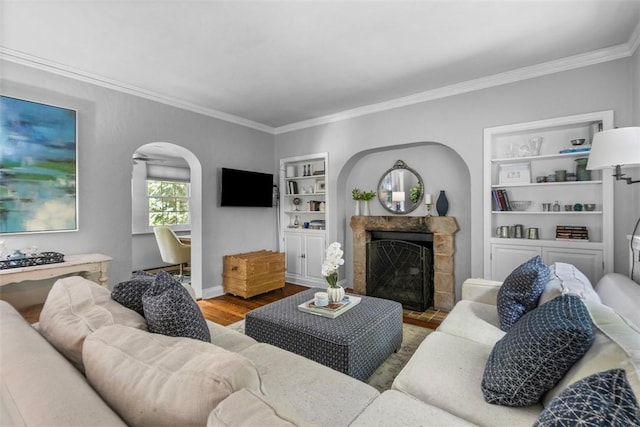 401 Parker Dr, Mt Lebanon, PA 15216 - living area with ornamental molding, built in shelves, arched walkways, wood finished floors, and a fireplace with flush hearth