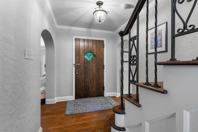 401 Parker Dr, Mt Lebanon, PA 15216 - entrance foyer featuring a textured wall, arched walkways, wood finished floors, ornamental molding, and baseboards