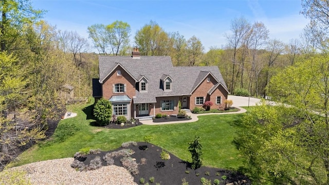 149 Walnut Ridge Dr, Chippewa Twp, PA 15010 - view of front facade featuring a chimney, a front lawn, and brick siding