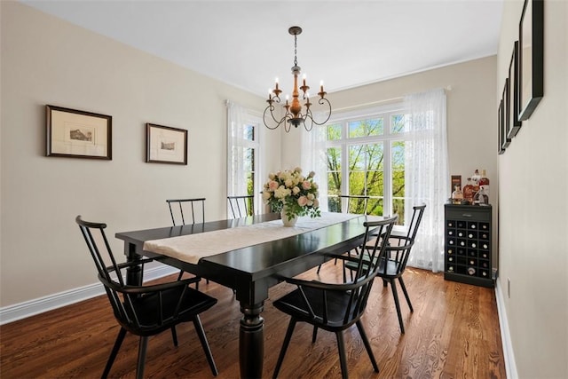 149 Walnut Ridge Dr, Chippewa Twp, PA 15010 - dining area featuring a chandelier, wood finished floors, and baseboards