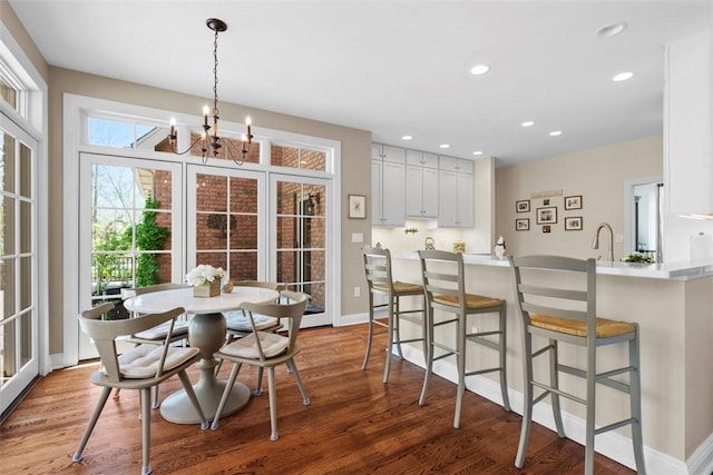 149 Walnut Ridge Dr, Chippewa Twp, PA 15010 - dining space with light wood-type flooring, a chandelier, baseboards, and recessed lighting