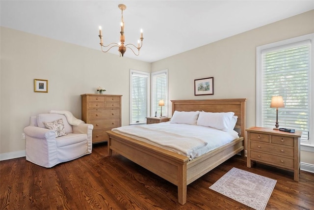 149 Walnut Ridge Dr, Chippewa Twp, PA 15010 - bedroom featuring a chandelier, wood finished floors, multiple windows, and baseboards