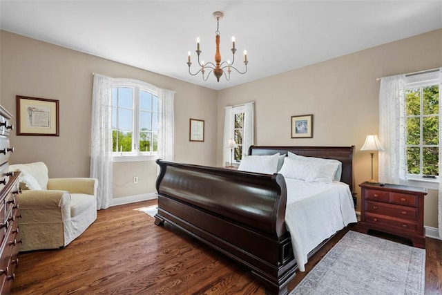149 Walnut Ridge Dr, Chippewa Twp, PA 15010 - bedroom with baseboards, a chandelier, and wood finished floors