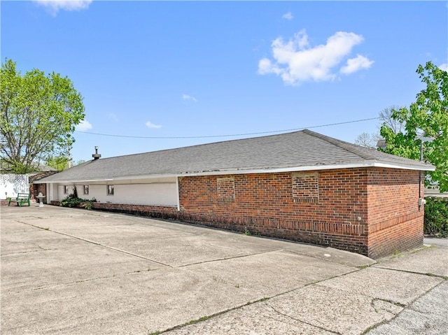134 Modisette Ave, Donora, PA 15033 - view of property exterior with brick siding and a shingled roof