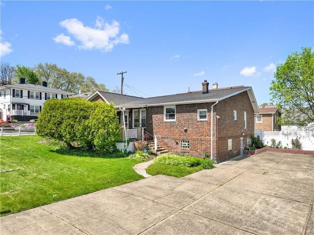 134 Modisette Ave, Donora, PA 15033 - back of house featuring brick siding and a chimney