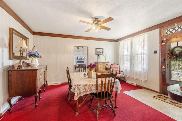 134 Modisette Ave, Donora, PA 15033 - carpeted dining room featuring a ceiling fan, ornamental molding, baseboards, and wooden walls