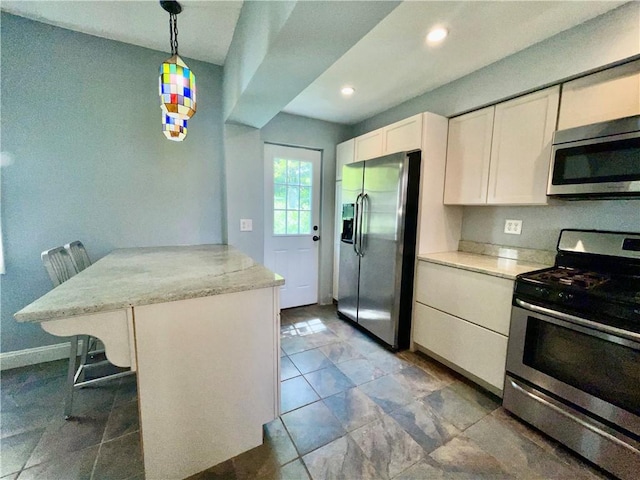 kitchen with stainless steel appliances, a peninsula, white cabinets, pendant lighting, and recessed lighting