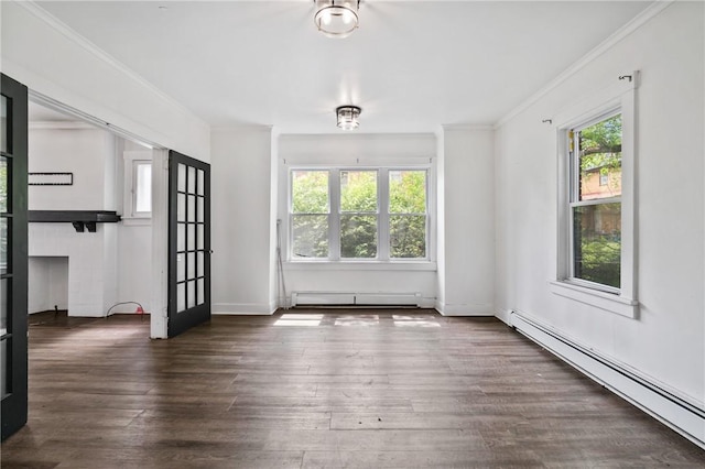 1008 Lowery St, Duquesne, PA 15110 - spare room featuring a baseboard heating unit, a baseboard radiator, plenty of natural light, ornamental molding, and wood finished floors