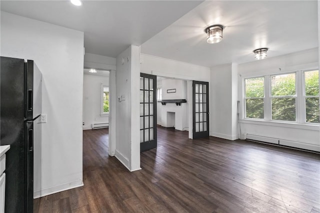 1008 Lowery St, Duquesne, PA 15110 - unfurnished living room featuring a baseboard radiator, wood finished floors, french doors, baseboards, and a baseboard heating unit