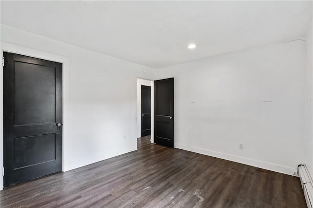 1008 Lowery St, Duquesne, PA 15110 - empty room with baseboards, wood finished floors, baseboard heating, and recessed lighting