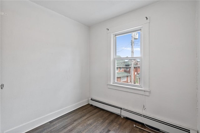 1008 Lowery St, Duquesne, PA 15110 - spare room with a baseboard heating unit, dark wood-style floors, and baseboards