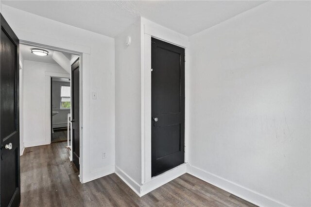 1008 Lowery St, Duquesne, PA 15110 - unfurnished bedroom featuring dark wood finished floors and baseboards