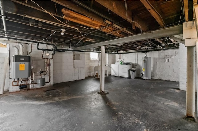 1008 Lowery St, Duquesne, PA 15110 - basement featuring gas water heater and independent washer and dryer
