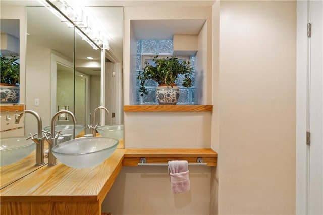 bathroom featuring double vanity