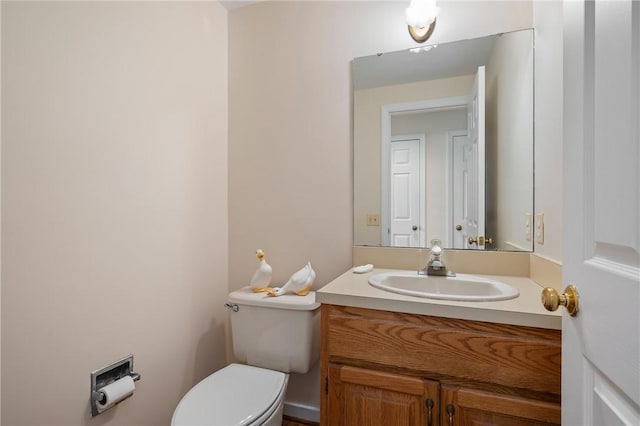 half bath with vanity and toilet
