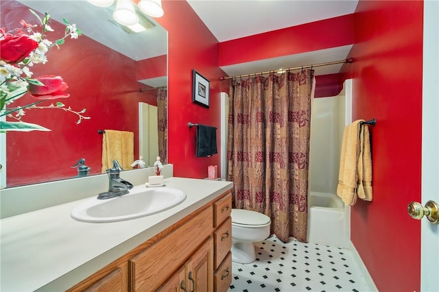 full bath with toilet, vanity, and shower / bath combo