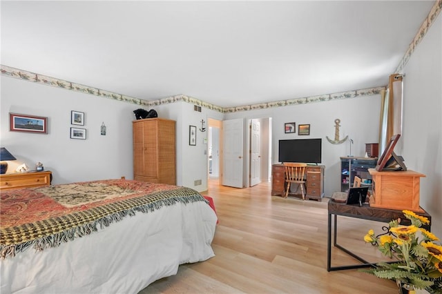 bedroom featuring light wood-type flooring