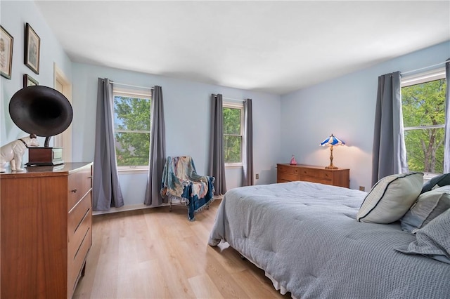 bedroom with light wood-style floors