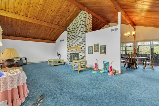 recreation room featuring a chandelier, beamed ceiling, wood ceiling, carpet flooring, and a brick fireplace