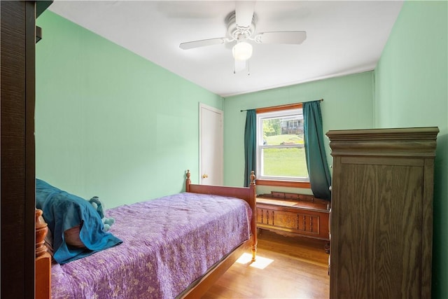 bedroom with wood finished floors and ceiling fan